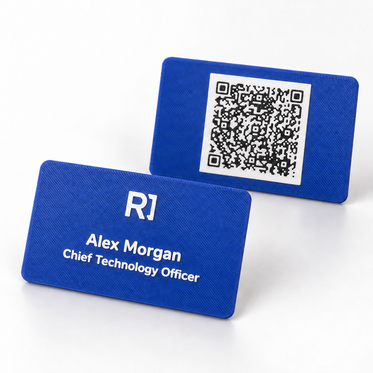 Product rendering of the blue 3D-printed sample business card, showing the personalized front and QR-code back
